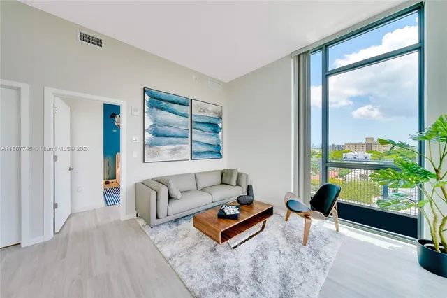 a kitchen with stainless steel appliances a stove a sink and a refrigerator