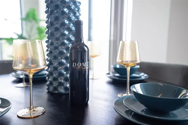 a kitchen with a sink and a potted plant