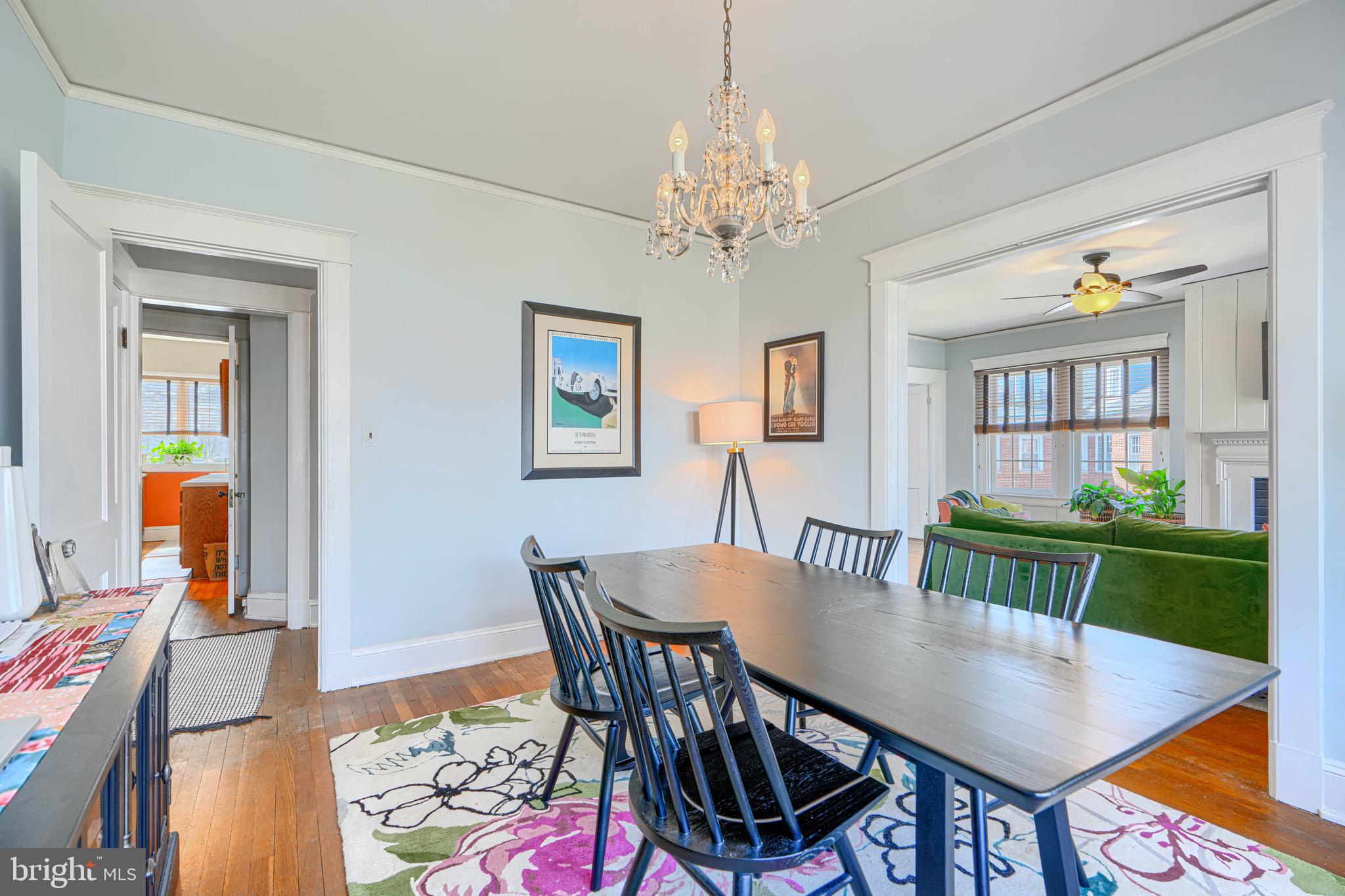 607 Somerset Road, Unit 5 Baltimore, MD 21210 - Photo 7 of 38 a view of a dining room with furniture and a chandelier