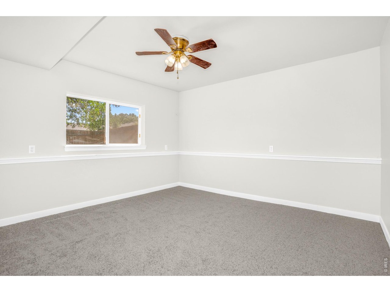 526 East 23rd Street Road Greeley, CO 80631 - Photo 4 of 20 a view of an empty room with a window
