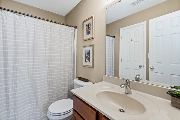 an aerial view of a house with a trees