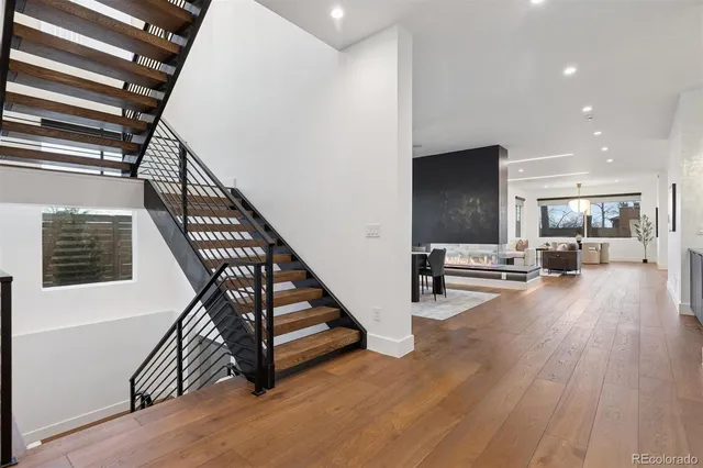 a view of entryway and hall with wooden floor