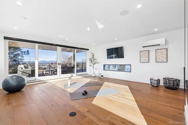 a spacious bedroom with a large bed and a large window