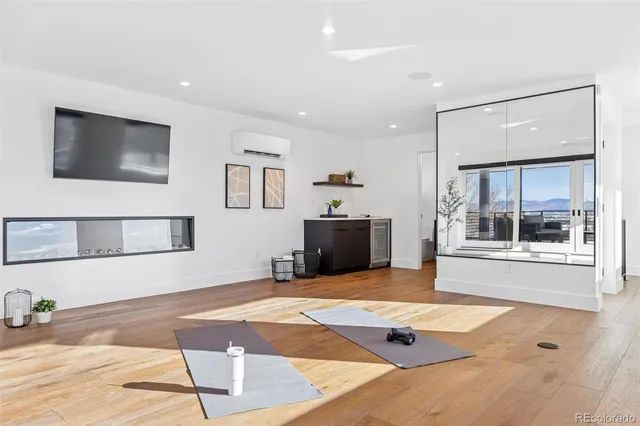 a view of a kitchen with a sink and a kitchen island