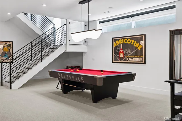 a room with table soccer and white walls