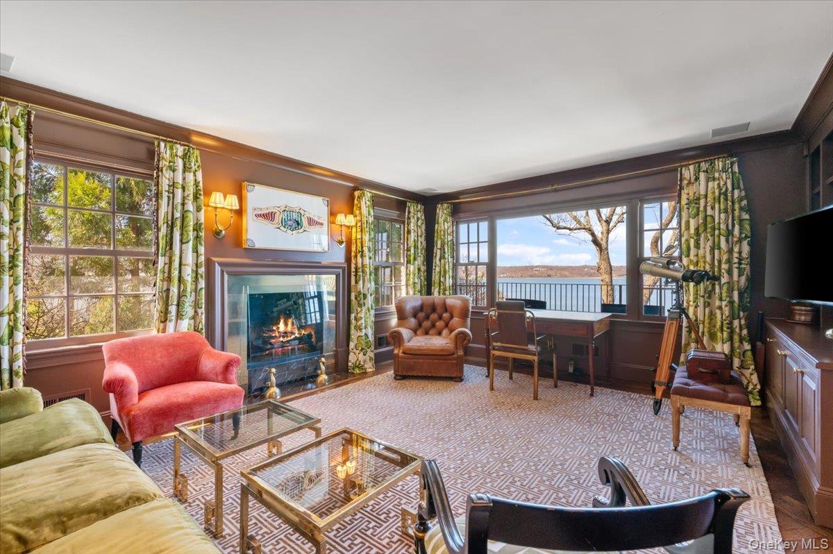 516 Centre Island Road Centre Island, NY 11771 - Photo 11 of 41 a living room with fireplace furniture and a large window
