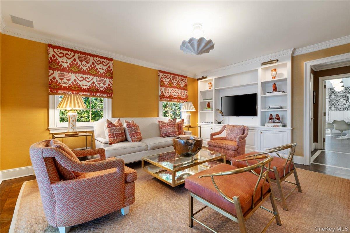 516 Centre Island Road Centre Island, NY 11771 - Photo 12 of 41 a living room with furniture and a flat screen tv