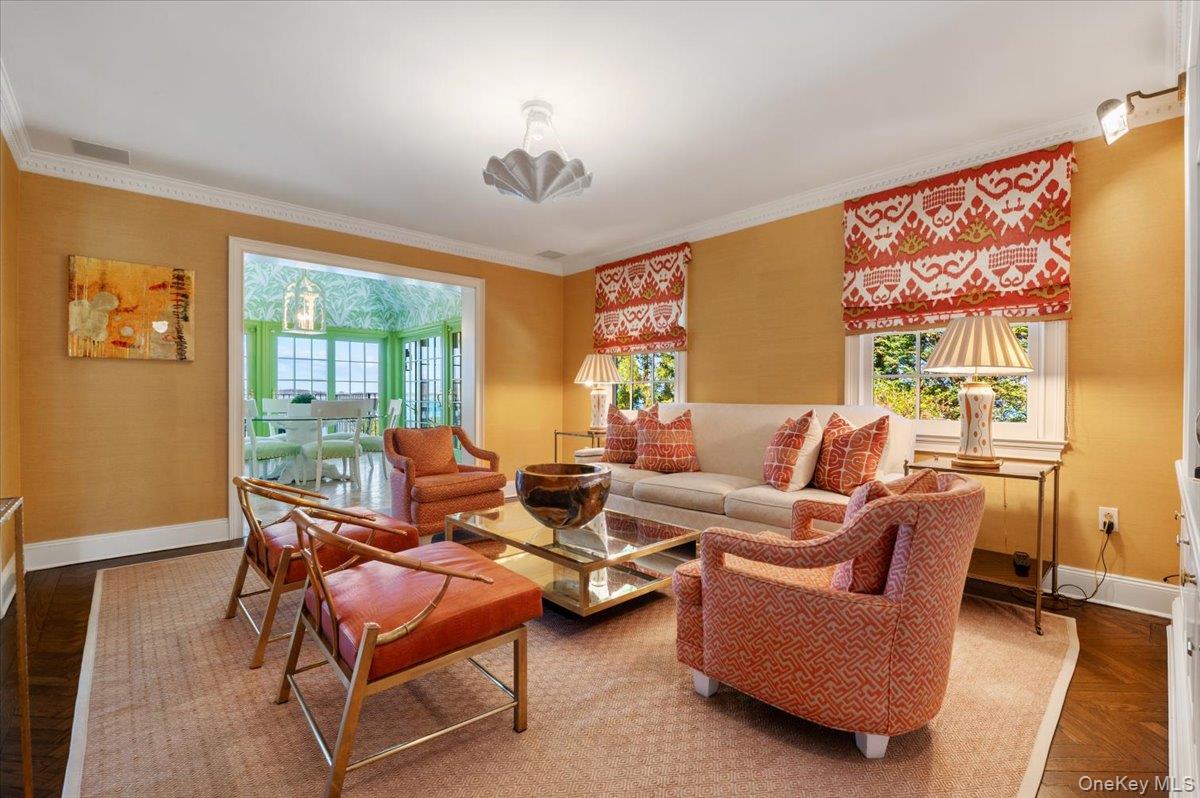 516 Centre Island Road Centre Island, NY 11771 - Photo 13 of 41 a living room with furniture a chandelier and a large window