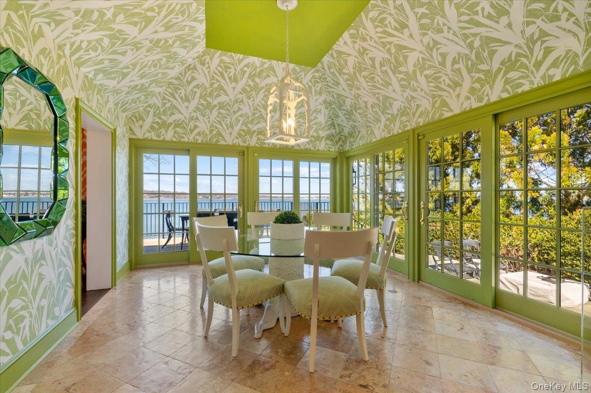 516 Centre Island Road Centre Island, NY 11771 - Photo 15 of 41 a dining room with furniture and large windows