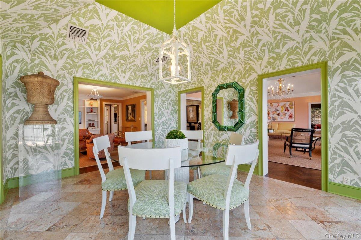 516 Centre Island Road Centre Island, NY 11771 - Photo 16 of 41 a view of a dining room with furniture and wooden floor