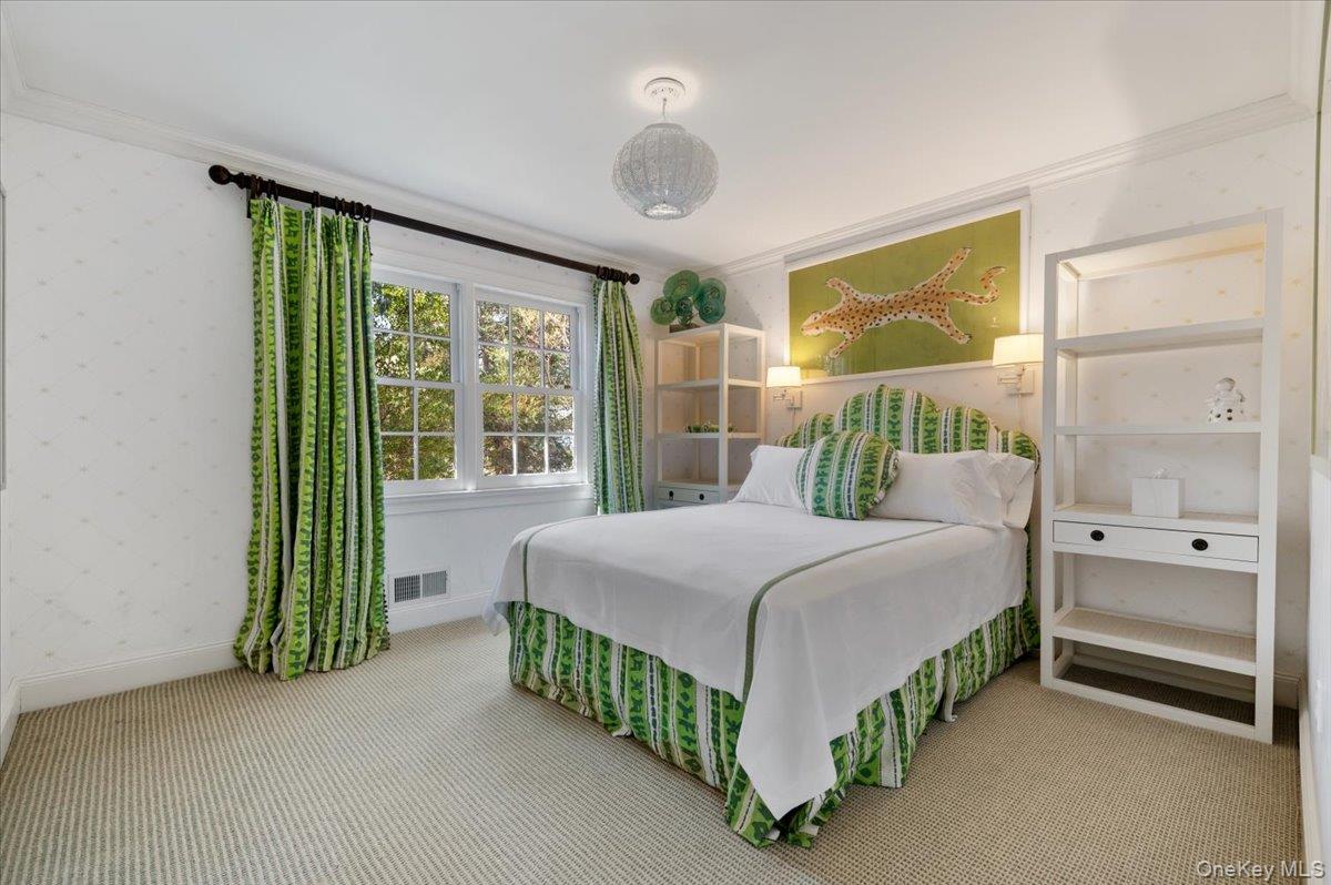 516 Centre Island Road Centre Island, NY 11771 - Photo 22 of 41 a bedroom with a bed and a large window