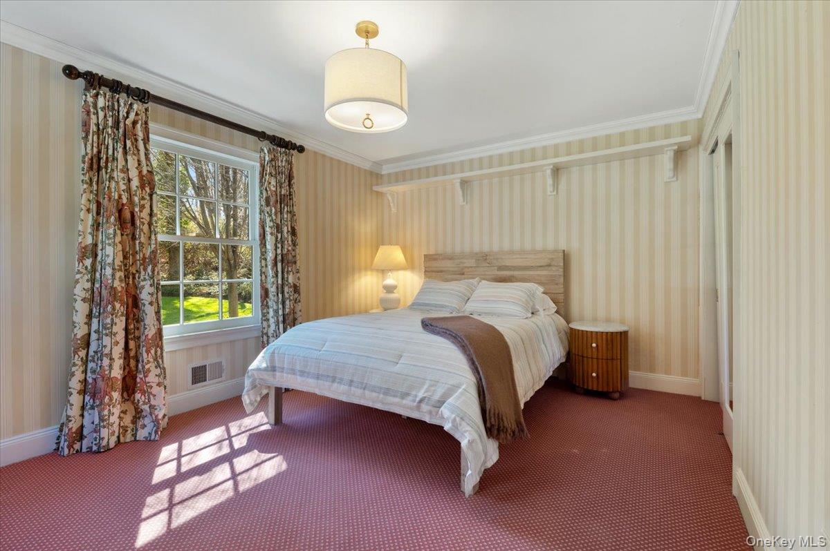 516 Centre Island Road Centre Island, NY 11771 - Photo 24 of 41 a bedroom with a bed and a window