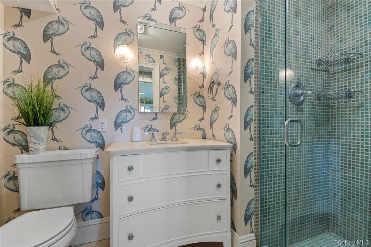516 Centre Island Road Centre Island, NY 11771 - Photo 28 of 41 a bathroom with a toilet sink and mirror