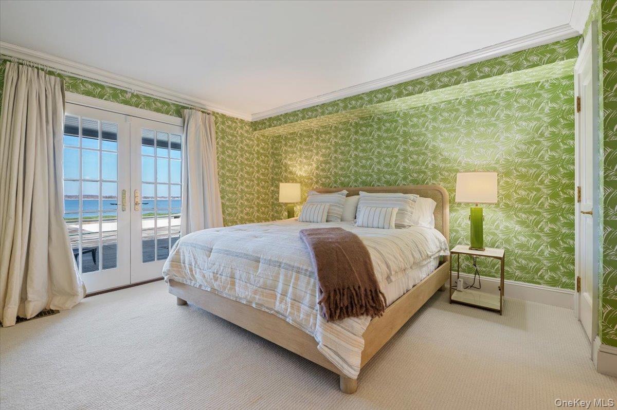 516 Centre Island Road Centre Island, NY 11771 - Photo 29 of 41 a bed sitting in a spacious bedroom next to a window