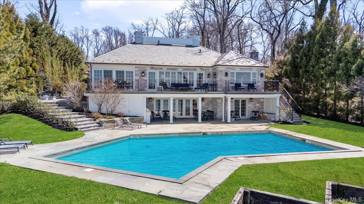516 Centre Island Road Centre Island, NY 11771 - Photo 33 of 41 a view of a house with pool and a yard
