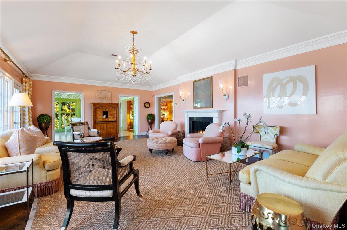 516 Centre Island Road Centre Island, NY 11771 - Photo 8 of 41 a living room with fireplace furniture and a chandelier