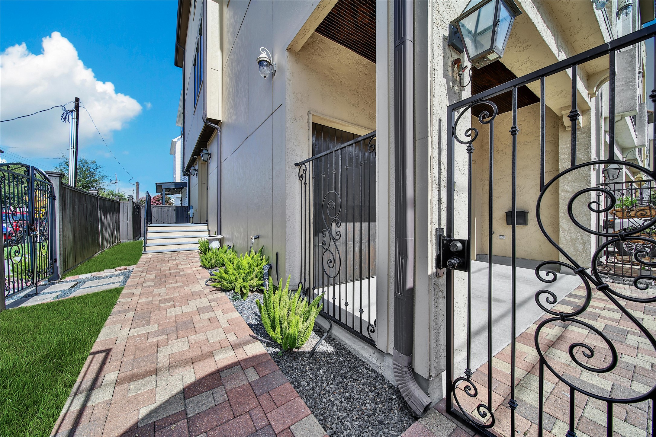 2301 Couch Street Houston, TX 77008 - Photo 2 of 22 a view of a pathway along a building