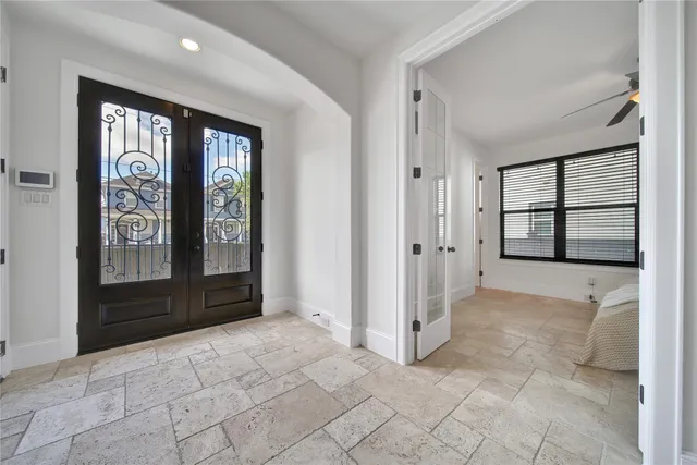 an empty room with windows and closet