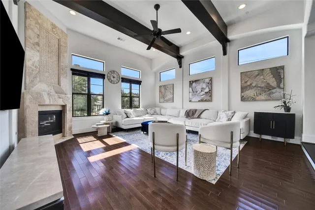 a living room with fireplace furniture and a flat screen tv