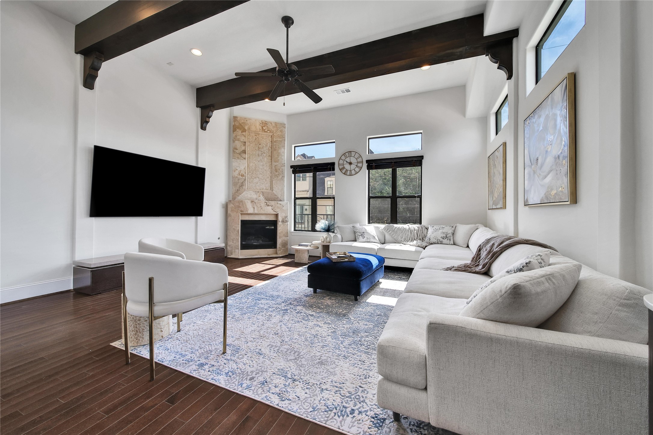 2301 Couch Street Houston, TX 77008 - Photo 10 of 22 a living room with fireplace furniture and a flat screen tv
