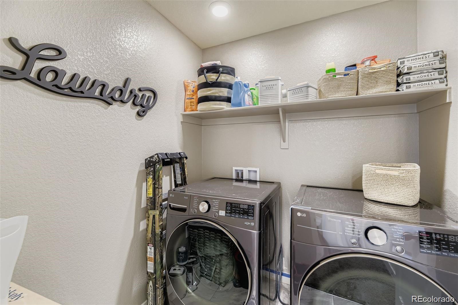 1173 Williams Loop Elizabeth, CO 80107 - Photo 12 of 30 a utility room with sink dryer and washer