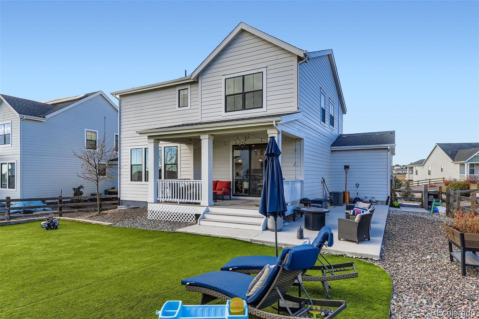 1173 Williams Loop Elizabeth, CO 80107 - Photo 23 of 30 a front view of house with a garden and patio