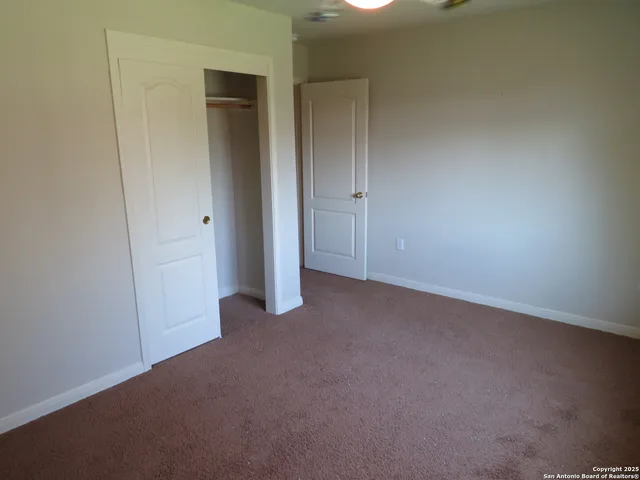 a view of a livingroom from a hallway
