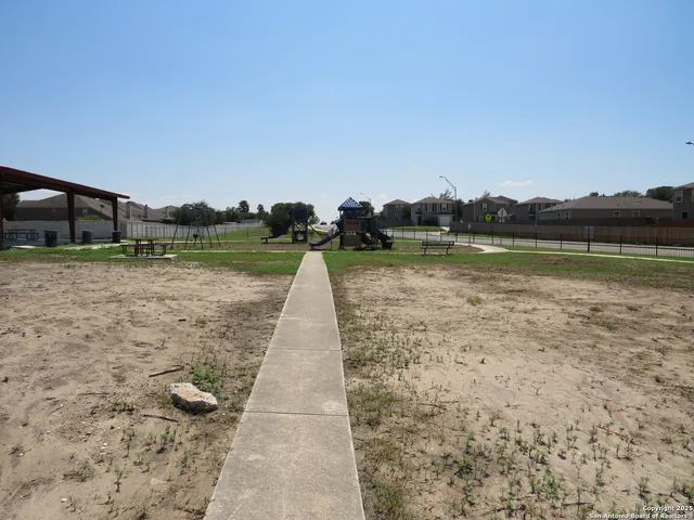 a view of a yard with a trampoline