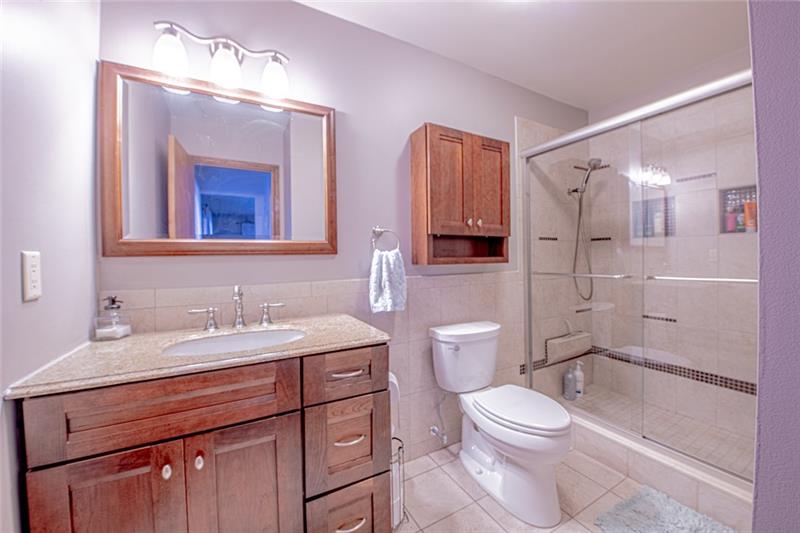 140 Stoup Road Mars, PA 16046 - Photo 14 of 25 Master bathroom has modern touches and tones.