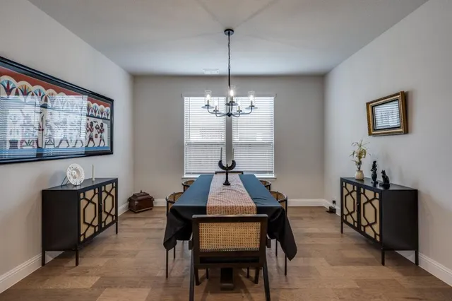 a dining room with furniture and window