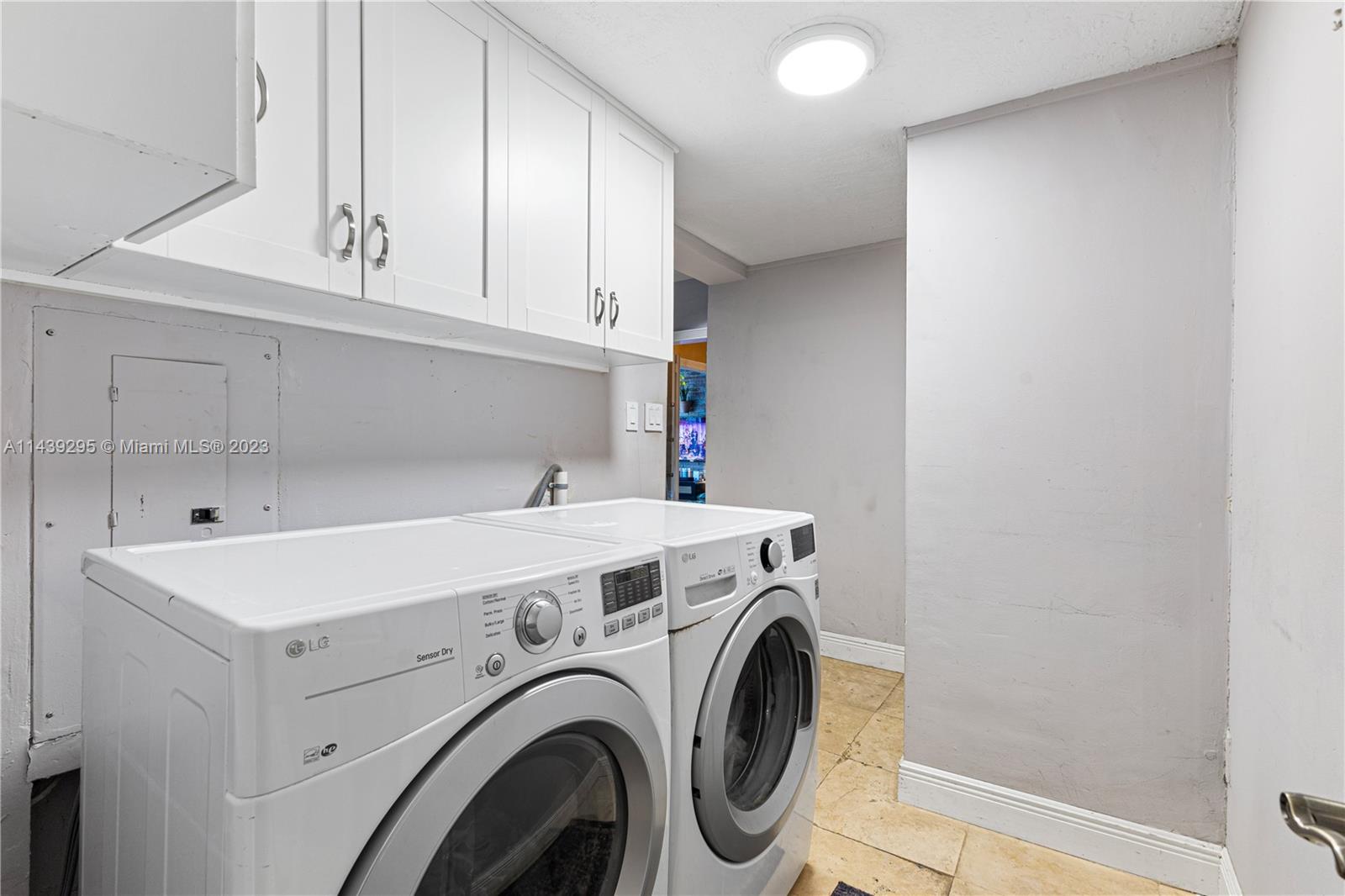201 Southwest 24th Road Miami, FL 33129 - Photo 14 of 18 a utility room with dryer and washer