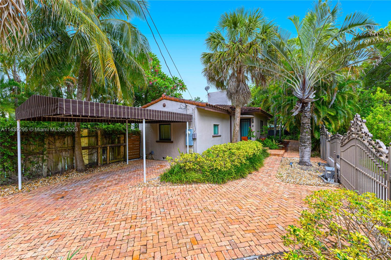 201 Southwest 24th Road Miami, FL 33129 - Photo 15 of 18 a front view of a house with garden