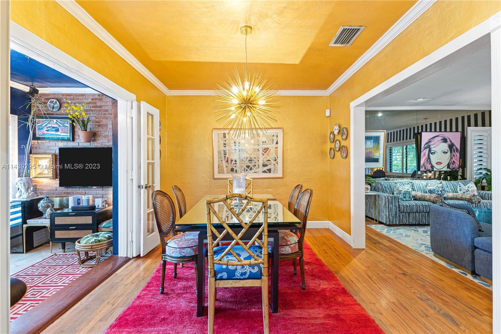 201 Southwest 24th Road Miami, FL 33129 - Photo 4 of 18 a view of a dining room with furniture and wooden floor
