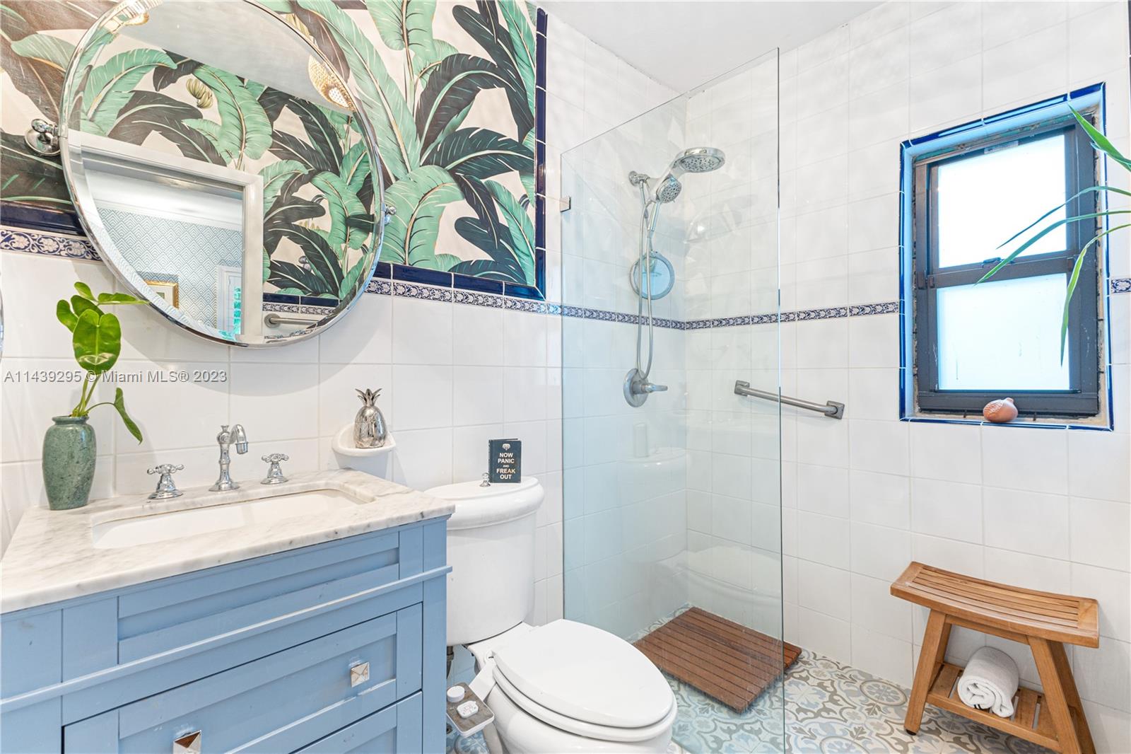 201 Southwest 24th Road Miami, FL 33129 - Photo 9 of 18 a bathroom with a toilet a sink and garden view