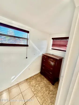 a room with a black white checkered floor
