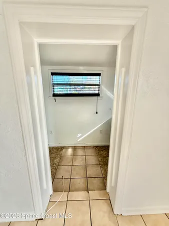 a view of staircase with white walls