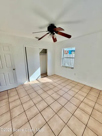 a bedroom with a bed and a walk in closet