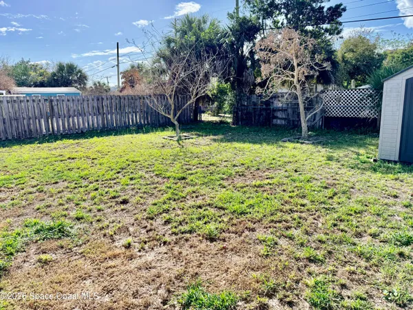 a view of a backyard with a garden