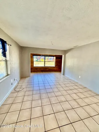 a view of an empty room and window