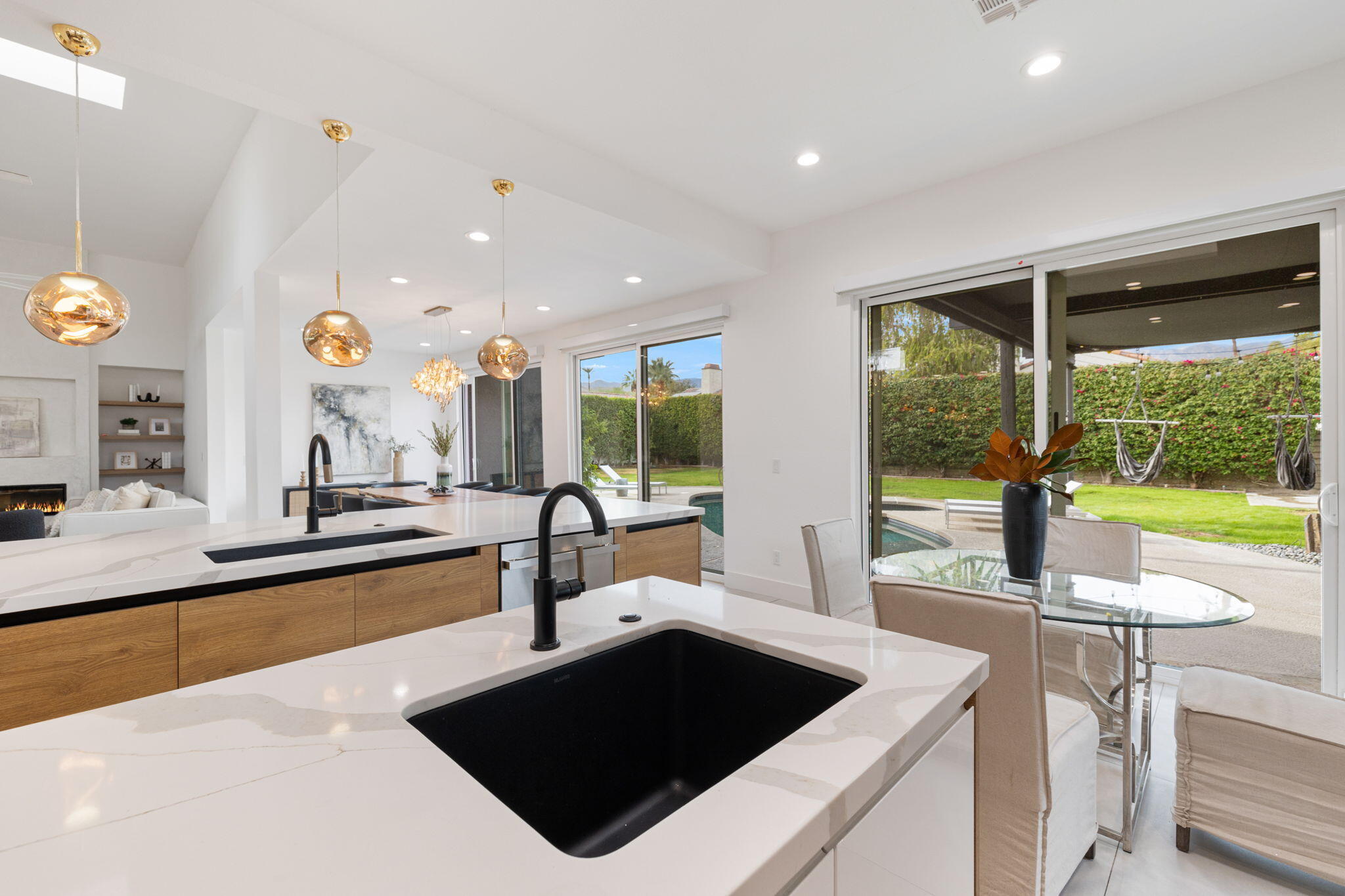 37011 Palmdale Road Rancho Mirage, CA 92270 - Photo 13 of 63 a kitchen with a sink and a large window