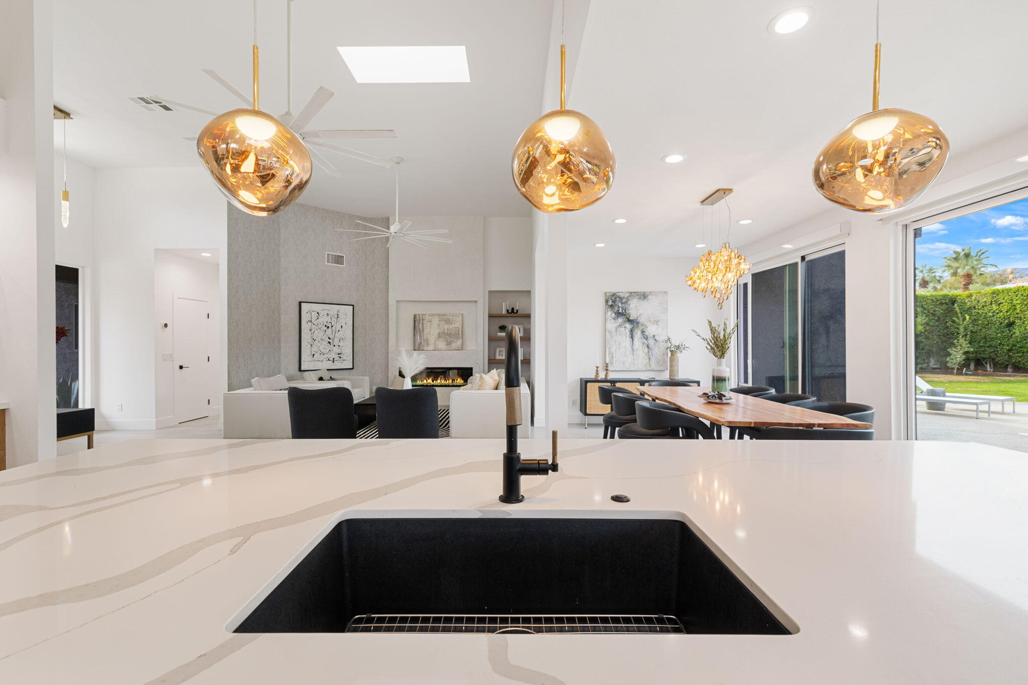 37011 Palmdale Road Rancho Mirage, CA 92270 - Photo 14 of 63 a kitchen with a table and a chandelier