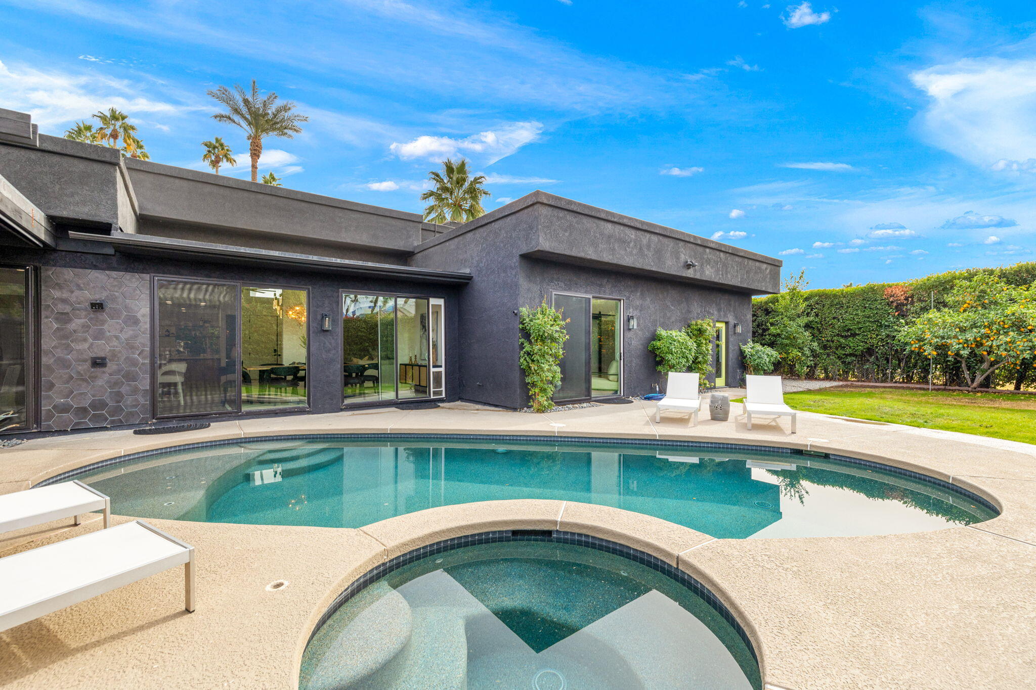 37011 Palmdale Road Rancho Mirage, CA 92270 - Photo 18 of 63 a view of a house with swimming pool and a outdoor seating