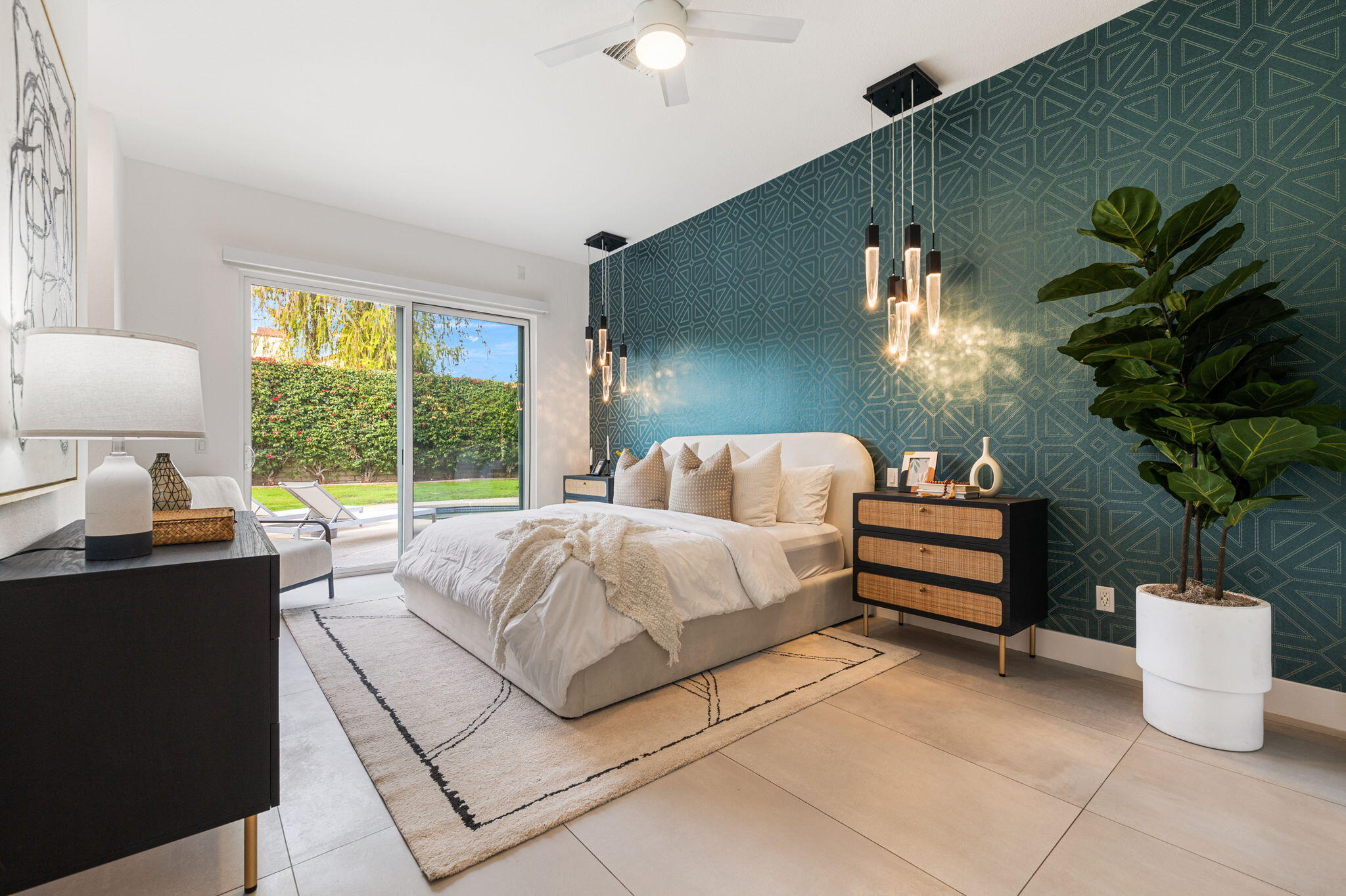 37011 Palmdale Road Rancho Mirage, CA 92270 - Photo 35 of 63 a bed room with a bed and a potted plant