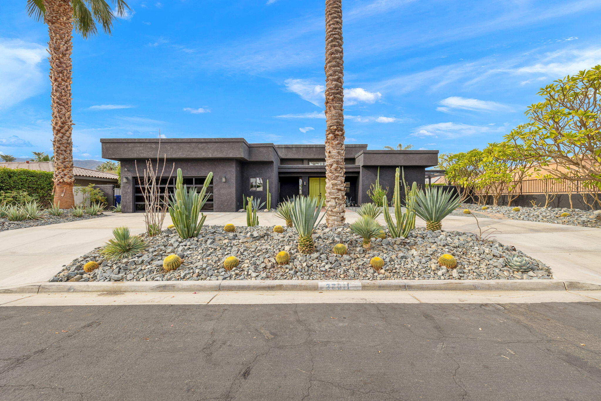 37011 Palmdale Road Rancho Mirage, CA 92270 - Photo 4 of 63 a front view of a building with garden