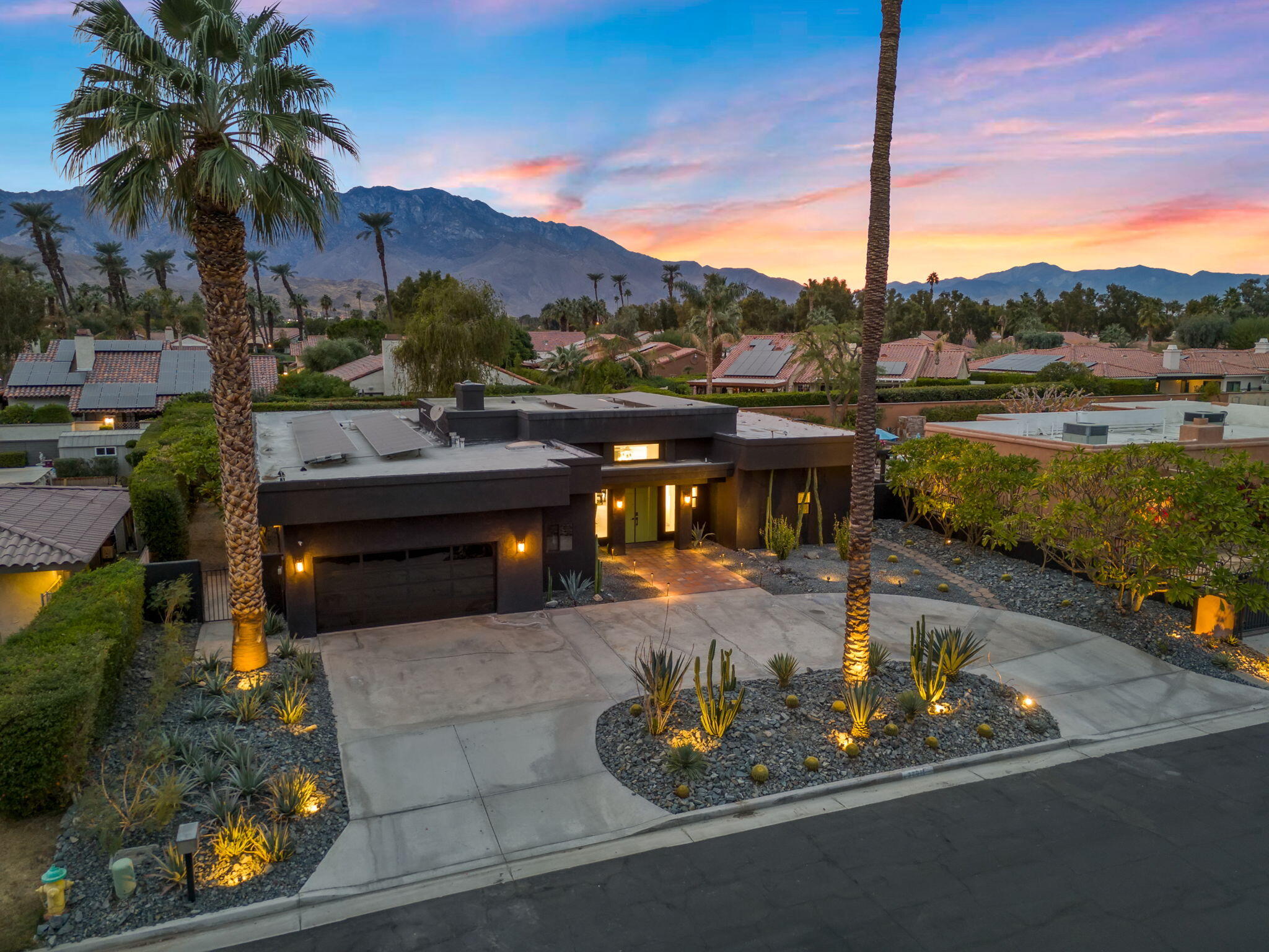 37011 Palmdale Road Rancho Mirage, CA 92270 - Photo 42 of 63 a view of a swimming pool with a patio and a yard