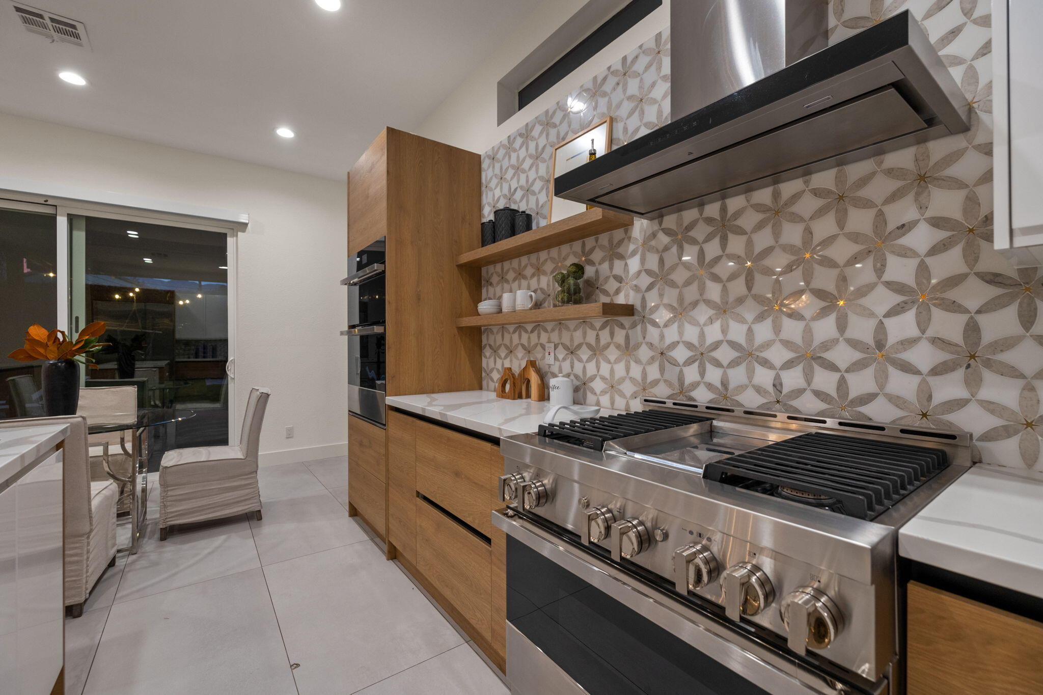 37011 Palmdale Road Rancho Mirage, CA 92270 - Photo 52 of 63 a stove top oven sitting inside of a kitchen