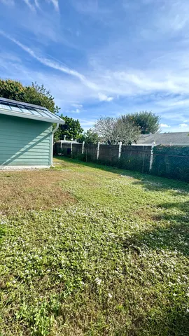 a view of a lake with houses in the back