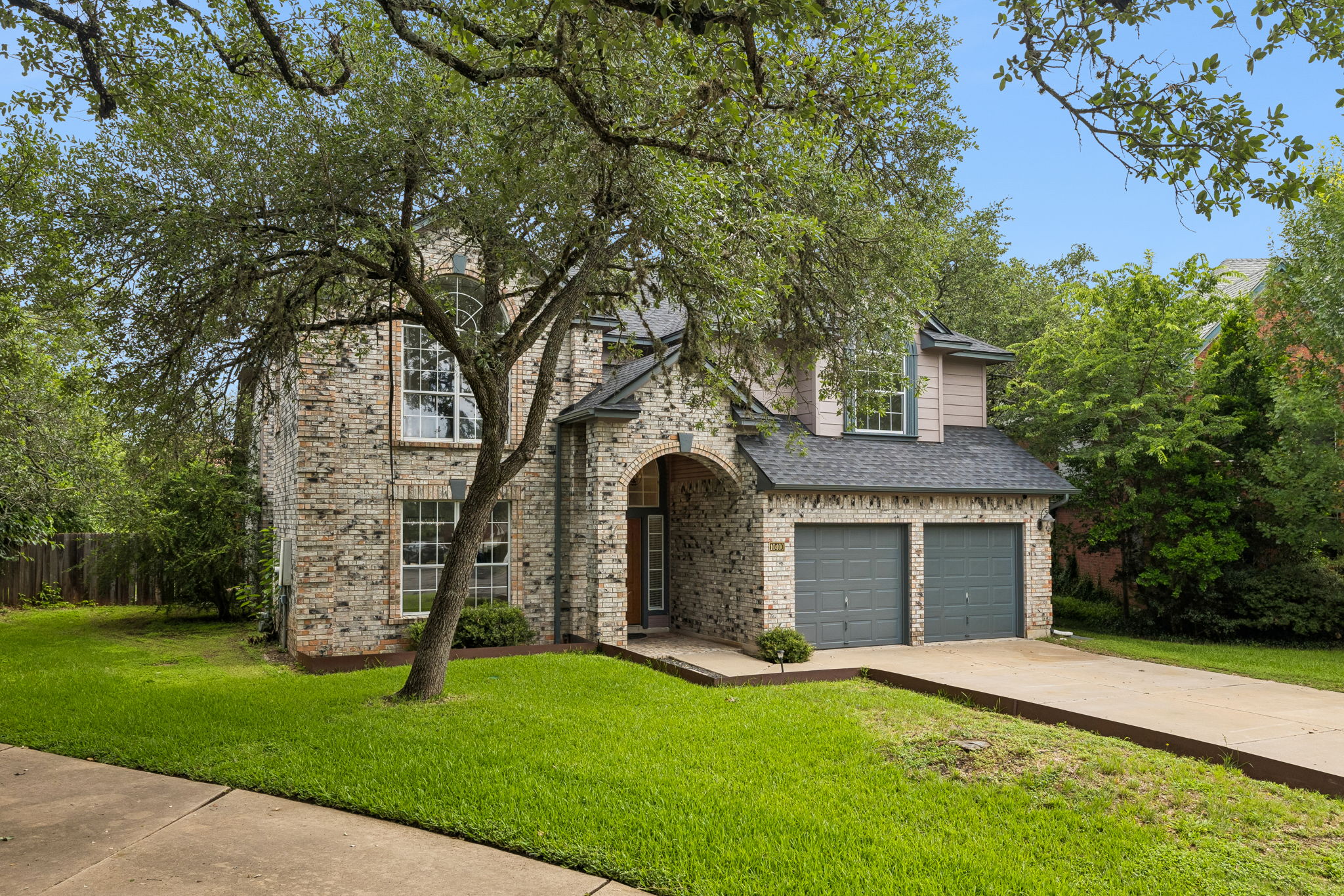 10400 O'Rourk Lane Austin, TX 78739 - Photo 2 of 33 front view of a house with a yard