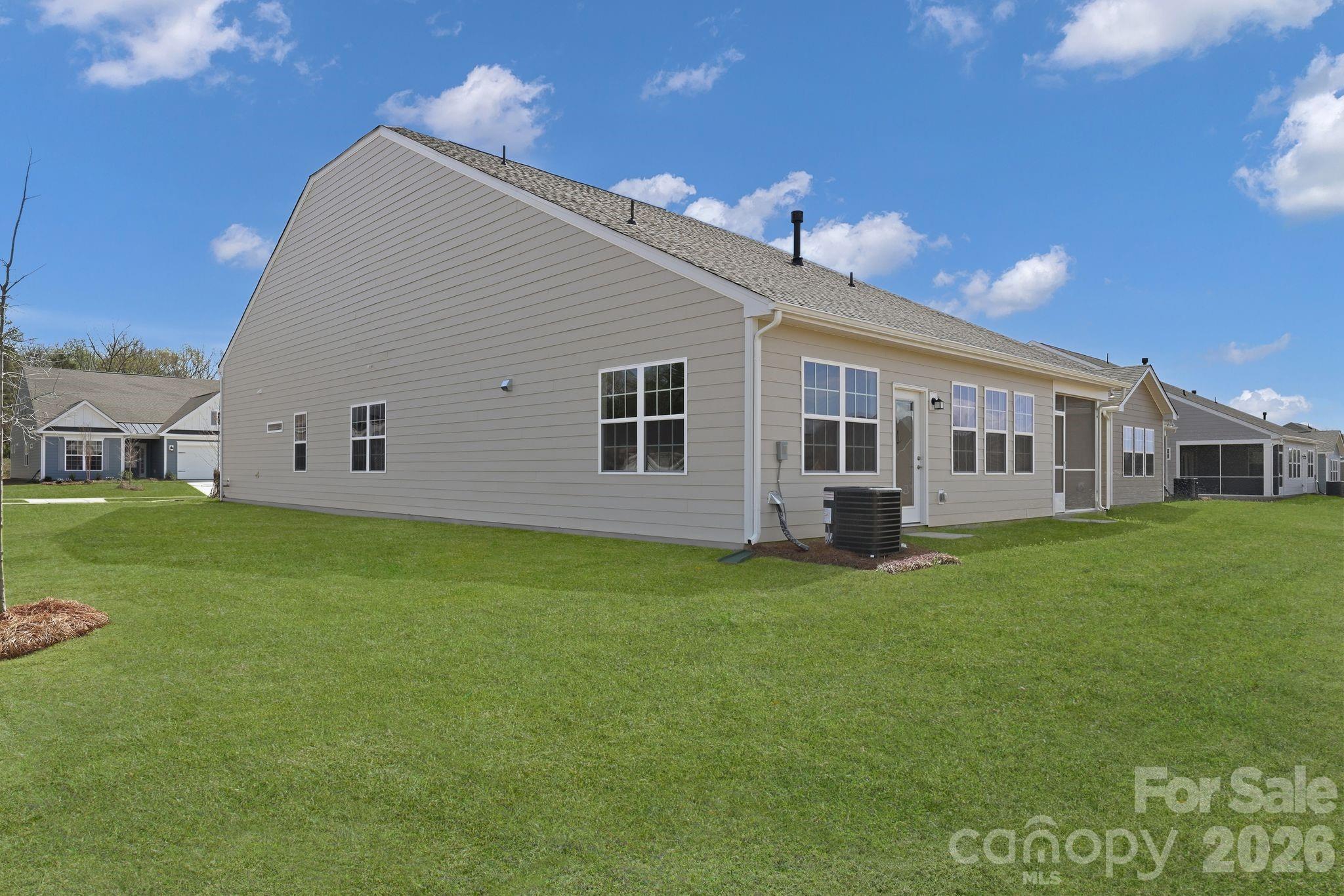 5475 Redbud Road, Unit 57 Lancaster, SC 29720 - Photo 4 of 30 a view of a house with a backyard