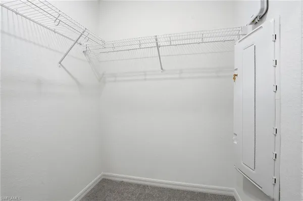 a bathroom with a toilet a sink a vanity and mirror